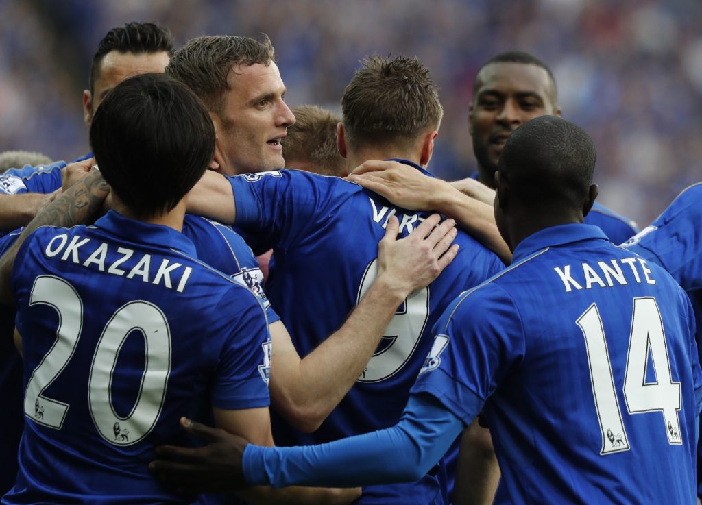 Leicester City's English striker Jamie Vardy (C) celebrates with teammates after scoring during the English Premier League football match between Leicester City and Everton at King Power Stadium in Leicester, central England on May 7, 2016. / AFP PHOTO / ADRIAN DENNIS / RESTRICTED TO EDITORIAL USE. No use with unauthorized audio, video, data, fixture lists, club/league logos or 'live' services. Online in-match use limited to 75 images, no video emulation. No use in betting, games or single club/league/player publications. /