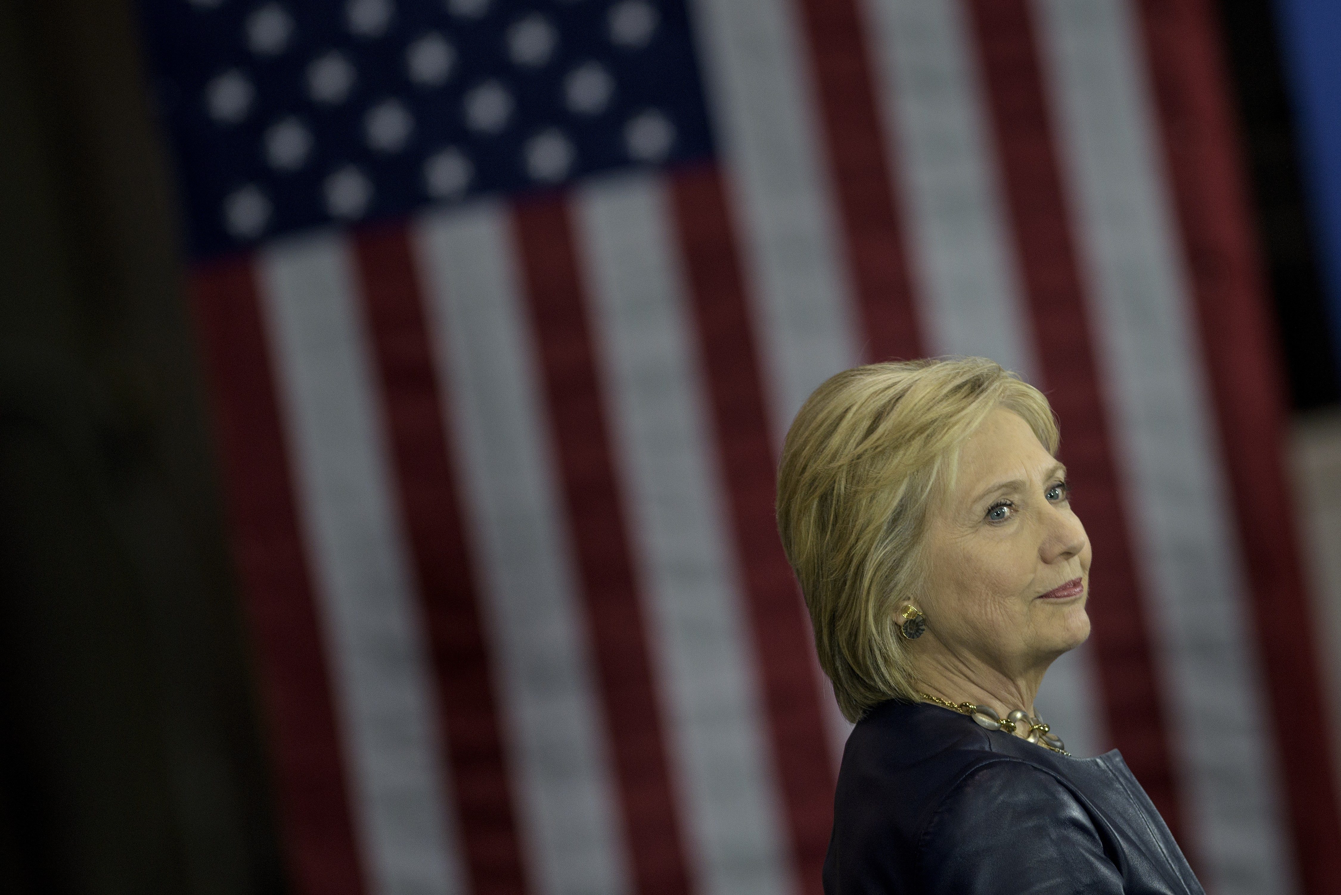 Democratic presidential candidate Hillary Clinton waits to address a rally on March 12, 2016 in Youngstown, Ohio. / AFP PHOTO / Brendan Smialowski