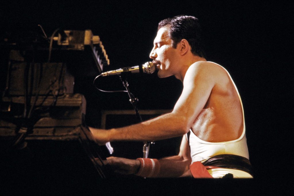 A file picture taken on September 18, 1984 showing Rock star Freddie Mercury, lead singer of the rock group "Queen", during a concert at the Palais Omnisports de Paris Bercy (POPB). / AFP PHOTO / JEAN-CLAUDE COUTAUSSE