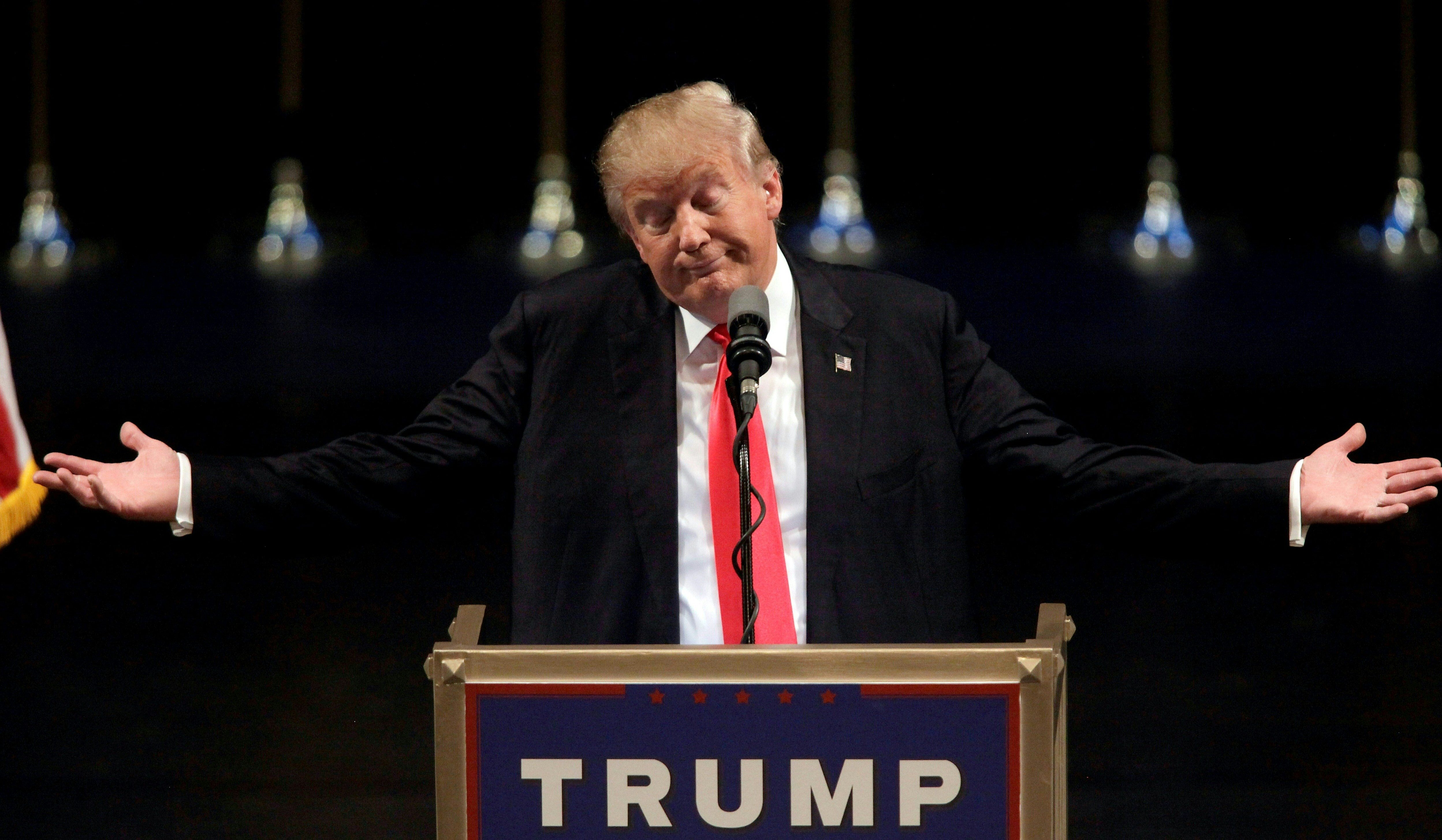 US Republican presidential candidate Donald Trump speaks during a rally at the Treasure Island Hotel in Las Vegas on June 18, 2016. / AFP PHOTO / JOHN GURZINSKI