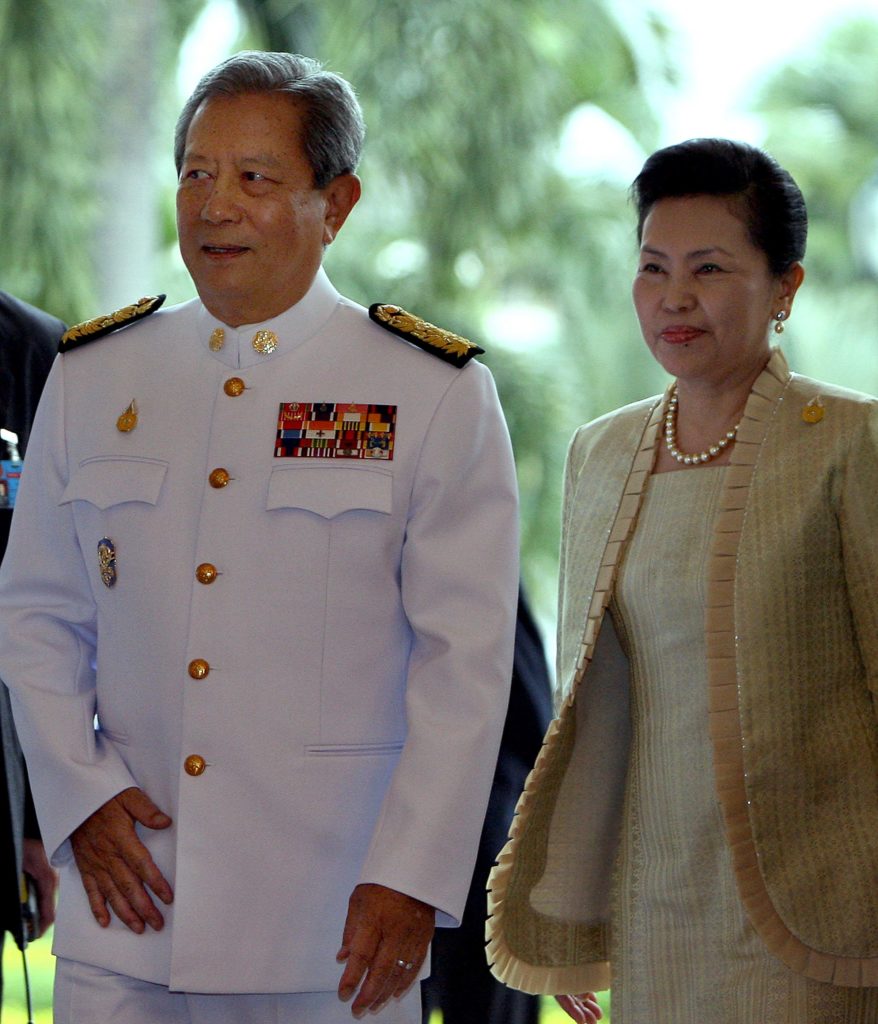 Thailand's newly appointed Prime Minister and former Thai army chief General Surayud Chulanont (L) arrives along with his wife Khunying Chitravadee Chulanout to speak with the media after his swearing in ceremony for the prime minister office at the Government House building in Bangkok, 01 October 2006. Thailand's new, military-appointed prime minister said that he wasn't sure if he deserved the job, but he had to "take the responsibility" after receiving a mandate from the king. AFP PHOTO/ Saeed KHAN / AFP PHOTO / SAEED KHAN