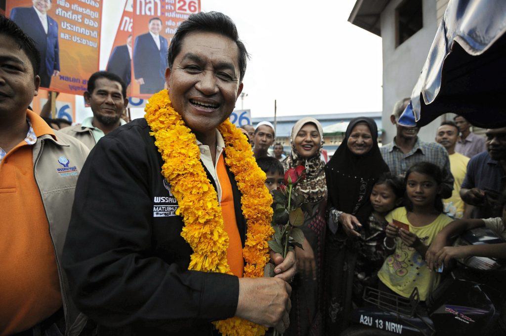 Former Thai Army commander-in-chief and candidate for the upcoming July 3 election, General Sonthi Boonyaratglin, the man who ousted from power fugitive ex-premier Thaksin Shinawatra in 2006, meets potential voters as part of an election campaign at Narathiwat market in the Thai restive southern province on June 28, 2011.  The divisions that plague Thai society will deepen further after the July 3 election unless arch-enemies within the political realm agree to respect the verdict of the polls, analysts say.   AFP PHOTO / MADAREE TOHLALA / AFP PHOTO / MADAREE TOHLALA