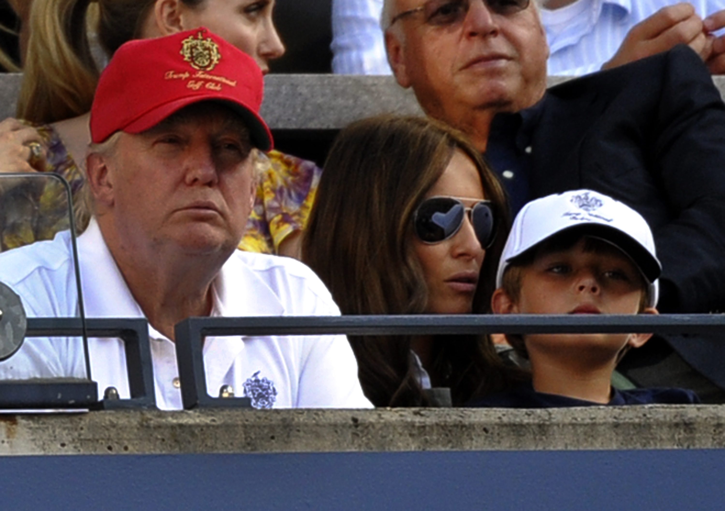 Donald Trump and his wife Melania Knauss-Trump and son Barron William Trump watch Roger Federer of Switzerland play Serbia's Novak Djokovic in the US Open semifinals at the USTA Billie Jean King National Tennis Center in New York on September 11, 2010. AFP PHOTO / TIMOTHY A. CLARY / AFP PHOTO / TIMOTHY A. CLARY